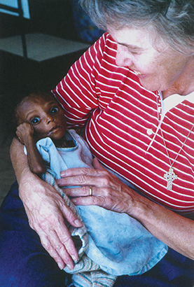 Sister Lorraine Malo, SSJ with Francesca, who suffers from severe malnutrition