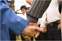 holding hands in prayer