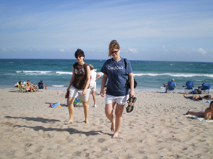 Sister Leslie Keener, C.D.P. and Sister Katy LaFond, O.S.F. stroll the beach during a gathering of sisters in their 20s and 30s. 