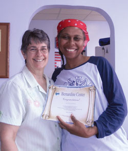 Vision 2016 Oatis 2 Feeding the poor enriches the lives of sisters Lyons (at left) with a graduate of the Super Cupboard Program.
