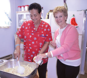 Vision 2016 Oatis 4 Feeding the poor enriches the lives of sisters Muus and a volunteer prepare a meal at the Bernardine Center.