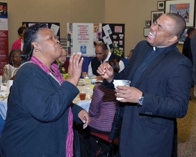 Vision 2016 Scheiber 8 Josephites have a dream Father Cornelius Ejiogu, S.S.J., pastor at St. Luke’s Catholic Church in Washington, D.C., enjoys a moment with a parishioner.