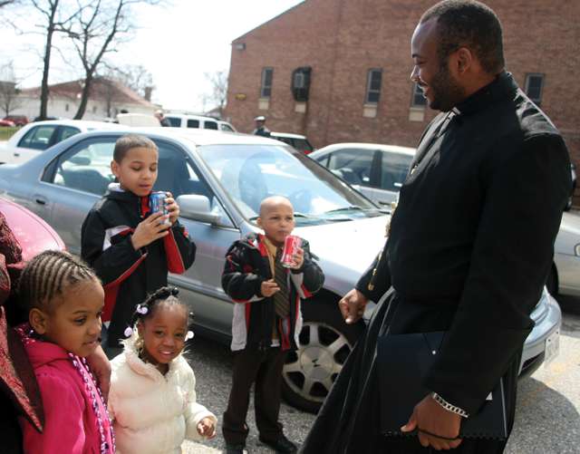 Vision 2016 Scheiber 9 Josephites have a dream Father Anthony Anichukwu, S.S.J talks with children after Mass