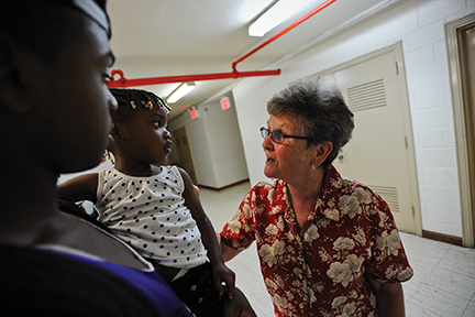 Vision 2017 Piazza 4 Sister T Fitzgerald talking to a mom and child