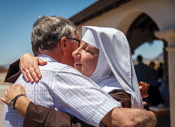 Vision 2017 Bering 12 Desert nuns find an oasis The new Sister Augusta Mary of Our Lady of Grace hugs a friend.