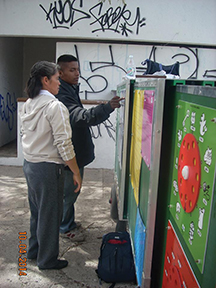 Vision 2017 Scheiber 3 Street-wise sisters on a roll Sister Lupita Silva, C.D.P. helps an older student understand a lesson he did not master at school.