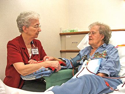 Vision 2017 Camille 2 Heaping helpings of mercy Hospital chaplain Sister Marilyn Herr, O.S.F. visits the sick, a corporal work of mercy.