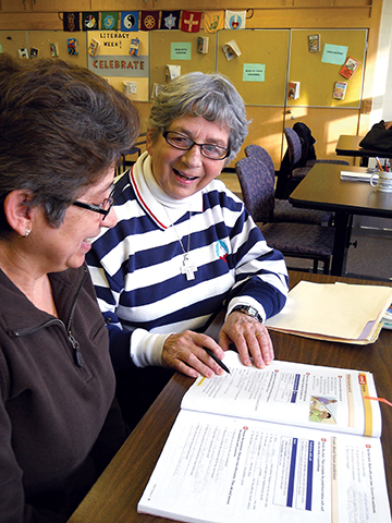 Vision 2017 Camille 4 Heaping helpings of mercy Sister Margaret LeClaire, S.S.S.F. helps a student improve her literacy skills
