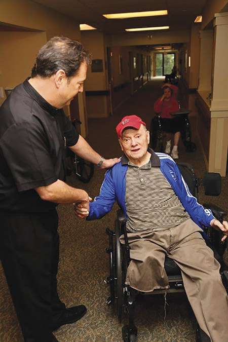 Vision 2018 O’Connell-Cahill 2 What is charism? Brother Tom Klein, C.F.A. speaks to a resident in a nursing home run by his community, the Alexian Brothers.