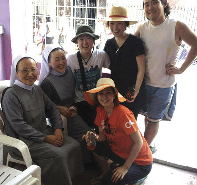 Vision 2018 Lee 1 Lights, camera—convent! Lee with the sisters and volunteers she met in Haiti who inspired her to become a sister herself.