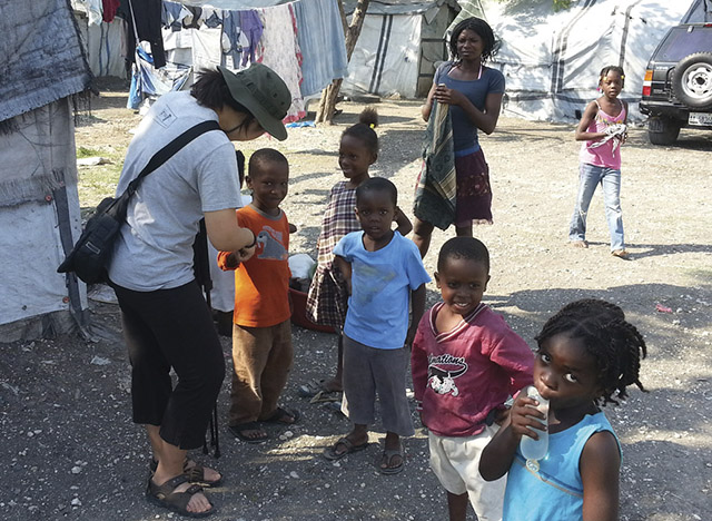 Vision 2018 Lee 5 Lights, camera—convent! Lee with children during a service trip to Haiti that influenced her vocation decision.