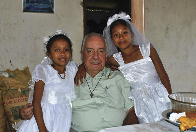 Vision 2018 Bragotti 4 Five reasons I love being a missionary priest Pictured here is Father Bragotti with two girls from San Luis Petén Parish in Guatemala in 2008.