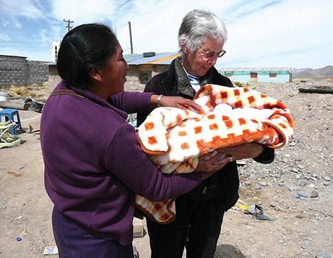 Vision 2019 Roche 3 See the Spirit in sisters Sister Jean Faustman, S.S.J. returns to her former ministry site in Yauri, Peru each summer to live among and minister to the people. Here, she admires an infant whose family she assisted.
