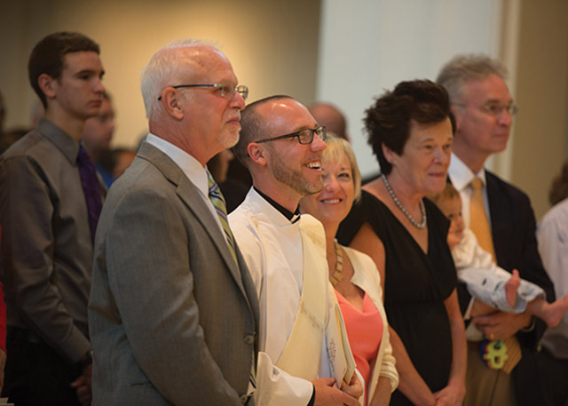 Vision 2019 Gilger 4 God rushes in Gilger with his parents on either side of him at his ordination Mass.