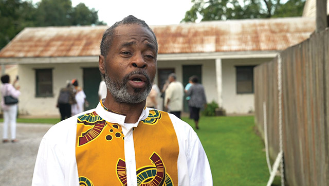 Vision 2021 Camille sidebar 1 What the church is teaching—and learning—about the sin of racism Leroy Hawkins, descendant of enslaved people held by the Society of the Sacred Heart, stands before the former quarters where his ancestors lived.