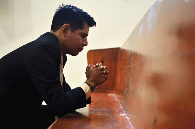 Vision 2021 Schuck Scheiber 2 Eight questions and answers to your prayers young man kneeling in a church pew praying