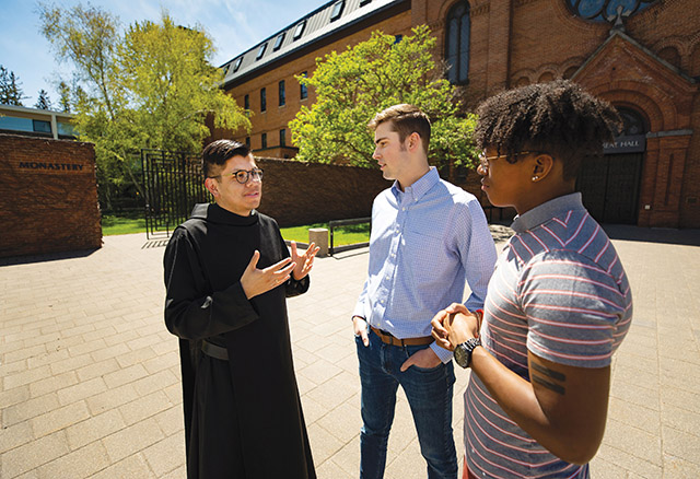 Vision 2021 Cutaia 1 Benedictines believe in balance Brother Mariano Mendez, O.S.B. answers questions from students at St. John’s University.