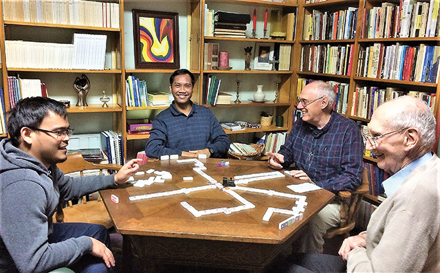 Vision 2021 Vision editors 3 Our newest religious Brothers of the Sacred Heart play a game of dominos