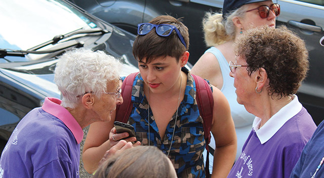 Vision 2021 Flansburg 4 Religious orders aid and advocate Sister JoAnn Persch, R.S.M. (left) and Sister Pat Murphy, R.S.M. (in purple shirts) are interviewed before taking part in a civil-disobedience action.