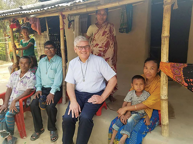 Vision 2021 Bednarczyk 2 What does it mean to be a brother? Brother Paul Bednarczyk, C.S.C. has tea with a family near Mariamnagar, Bangladesh.