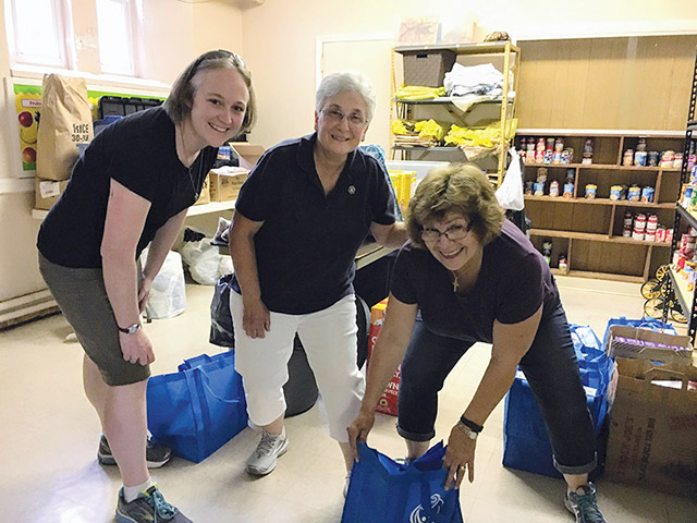 Vision 2021 Gibson 5 Sisterhood is different from singlehood Sister Colleen Gibson, S.S.J. (left) works in the food pantry of the Sisters of St. Joseph Neighborhood Center in Camden, New Jersey.