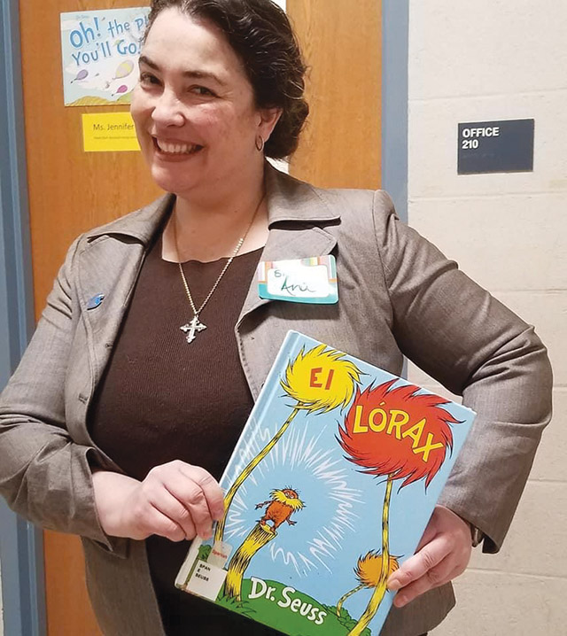 Vision 2022 Flansburg 3 A zigzagging road to the convent Sr. Gonzalez shows off a book she read to elementary school students as part of a National Reading Day celebration.