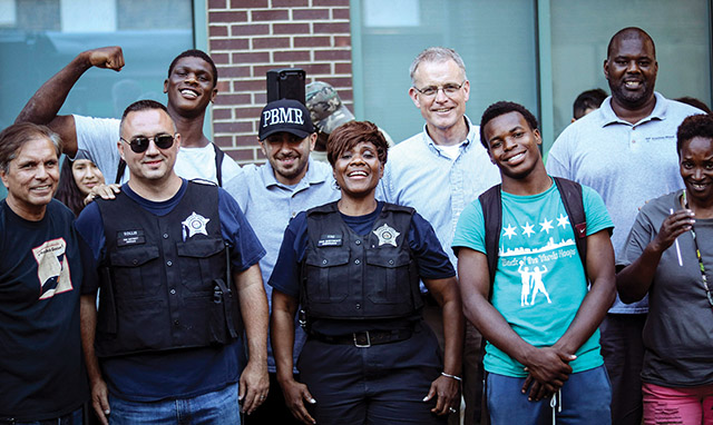 Vision 2022 Kelly 4 In search of healing, one story at a time Along with area residents and local police, Father Dave Kelly, C.PP.S. takes part in an event called Light the Night, a community gathering with food, sports, and socializing.
