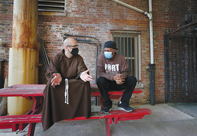 Vision 2023 Duriga 4 A priest (who’s been there) responds to the pain of addiction Father M.J. Groark, O.F.M.Cap. chats with Anthony Brown, bread truck coordinator for Port Ministries in Chicago.