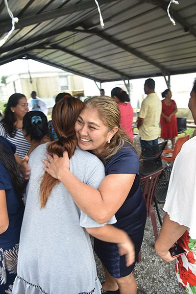Vision 2023 Feister 11 Ministering to migrants in a carport cathedral María Dolores Cerino García, has a big smile today at the Sign of Peace