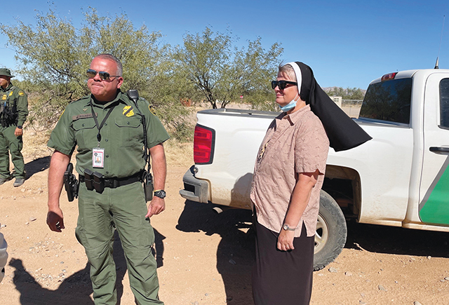 Vision 2024 Feister 7 Mercy meets at the border Felician Sister Maria Louise Edwards, C.S.S.F. is at the Arizona border, in the Tohono O’odham Nation, with a border officer.