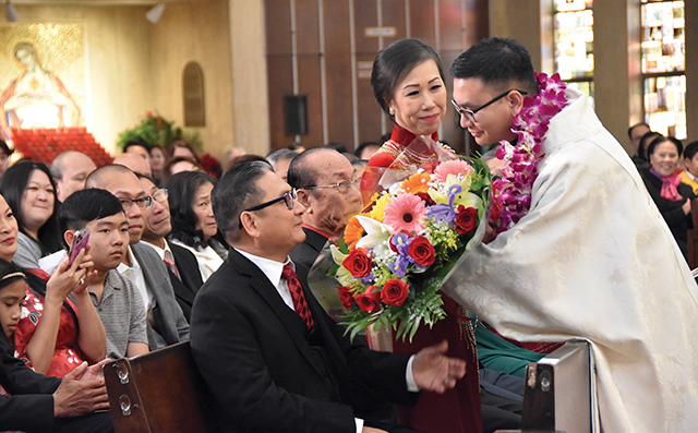 Vision 2024 Spotlight 7 Religious communities have deep and diverse roots Father Henry Nguyen, S.C.J. with his parents during his ordination Mass.