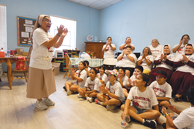 Vision 2024 McCulloh 1 Sisters help Uvalde move from trauma to trust Sister Dolores Avila, S.T.J. leads children in an activity.
