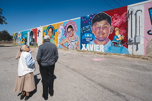 Vision 2024 McCulloh 9 Sisters help Uvalde move from trauma to trust Sister Dolores Avila, S.T.J. and Catholic Extension President Father Jack Wall stand before murals of the 19 children and two adults killed by the Uvalde gunman.