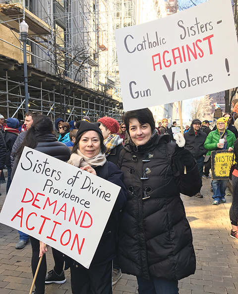 Vision 2024 Flansburg 2 Bringing sacred healing to hurting communities Sisters Karina Conrad and Ana Lydia Sonera, C.D.P. at the March for Our Lives demonstration in Pittsburgh.
