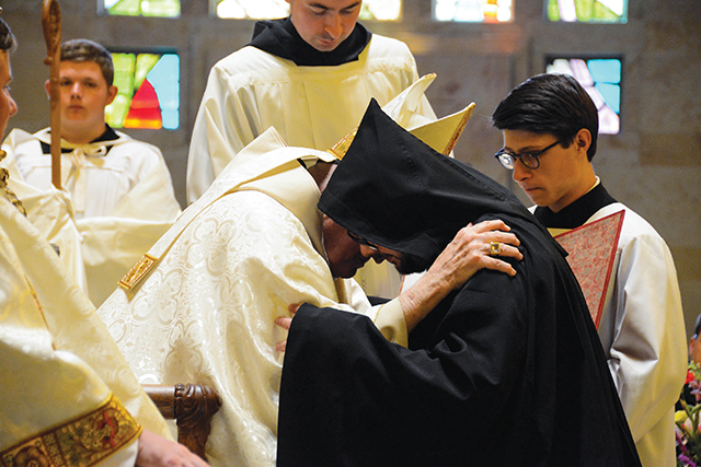 Vision 2024 Pautler 6 Monastic life is habit-forming The abbot clothes a newly professed monk with the cuculla after his solemn vows.