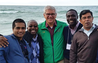 Brother Paul Bednarczyk, C.S.C. (center in green jacket) with other Holy Cross leaders at Lake Michigan.